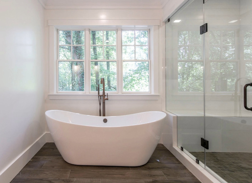 Custom Freestanding Soaking Tub Near Window | Tulacro Development