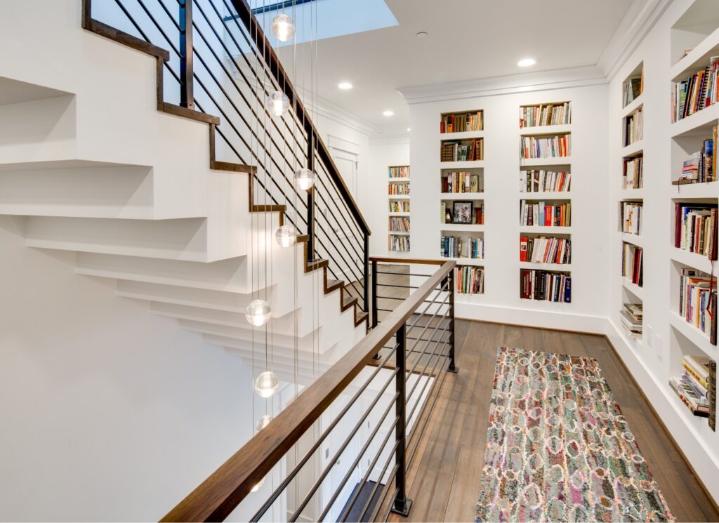 Built-In Bookcases in Staircase Hallway in Tulacro Development Custom Home | Tulacro Development | Luxury Custom Home Builders | Bethesda, MD | Montgomery County
