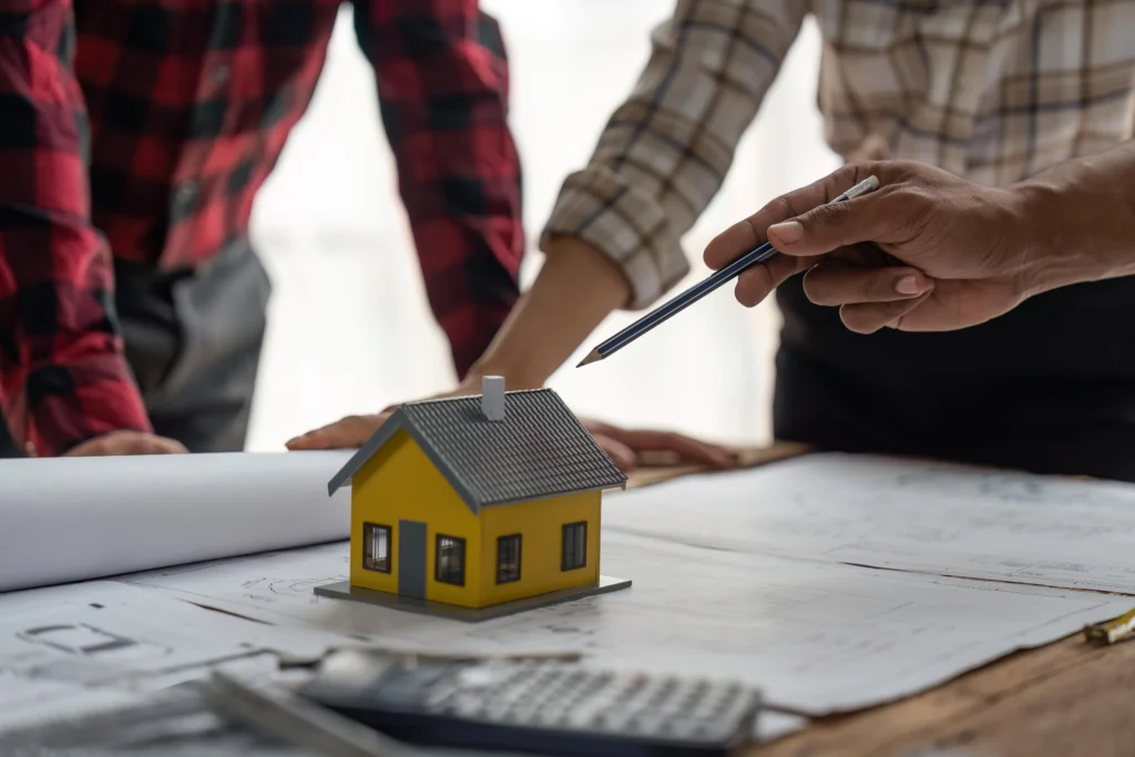 How Much Does It Cost to Build a New House planning with model and blueprints.